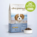 Croquettes Super Premium pour chiot de petite et moyenne taille en sac de 12 kg sur fond bleu clair