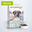 Kom gevuld met zalmhuid- en vachtbrokken voor volwassen honden van alle maten