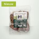 Zak varkensoren voor hond op lichtgroene achtergrond
