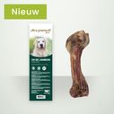 Zakje hambot voor honden op een lichtgroene achtergrond