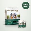 Dubbel voeding bestaande uit een zak graanvrije brokken van 4 kg voor hond met een gevoelige spijsvertering en 2 blikjes met lam, op een lichtgroene ondergrond