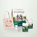 Welkomstpakket voor puppy's met een gevoelige spijsvertering van alle groottes, op een lichtgroene achtergrond