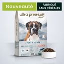 Gamelle remplie de croquettes peau et pelage pour chien adulte toutes tailles au saumon