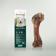 Sachet d'os de jambon pour chien sur fond vert clair 